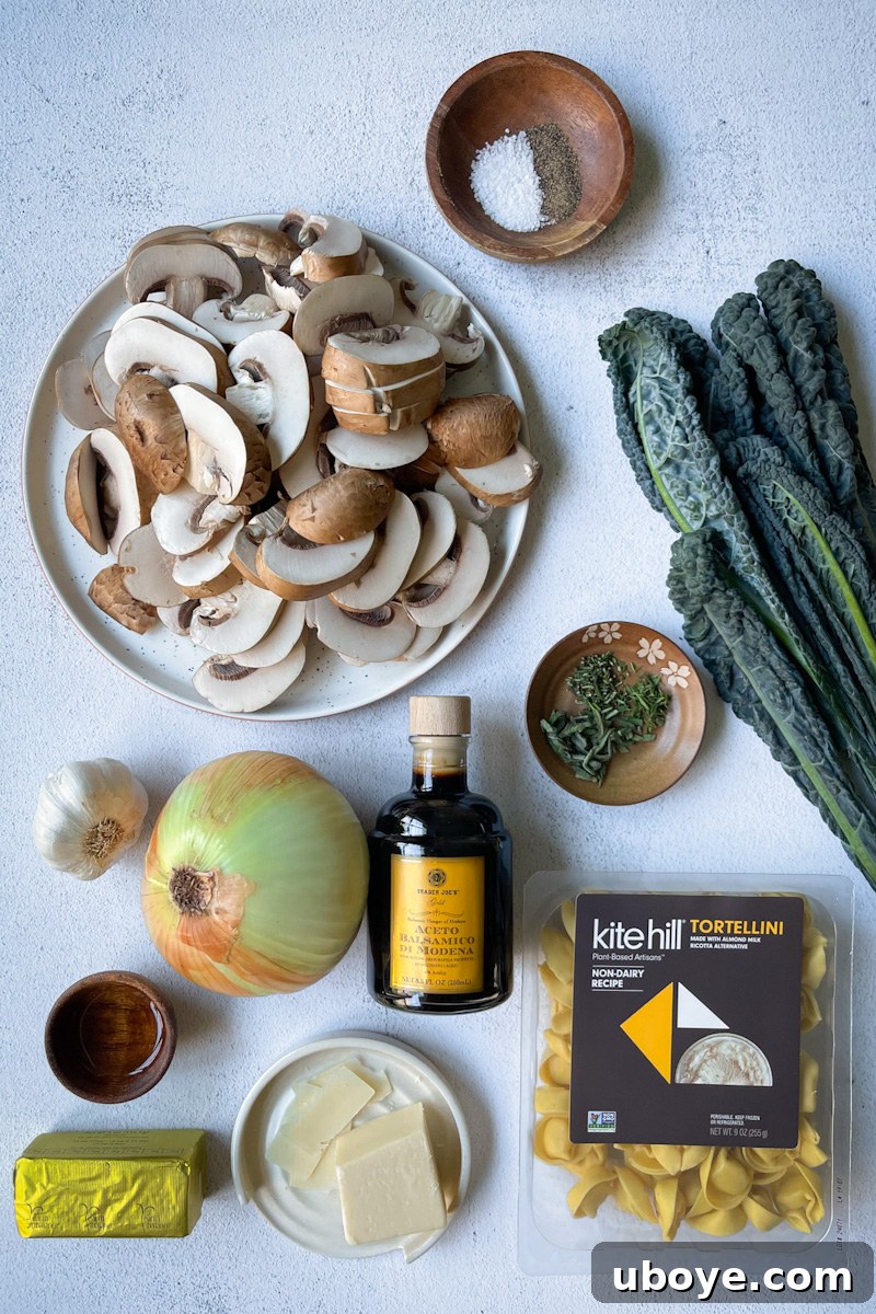 Savory Balsamic Mushroom Tortellini 4 Assortment of fresh ingredients including mushrooms, kale, herbs, garlic, and onion.