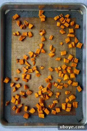 Savory Sweet Potato Skillet 11 roasted sweet potatoes on a cookie sheet