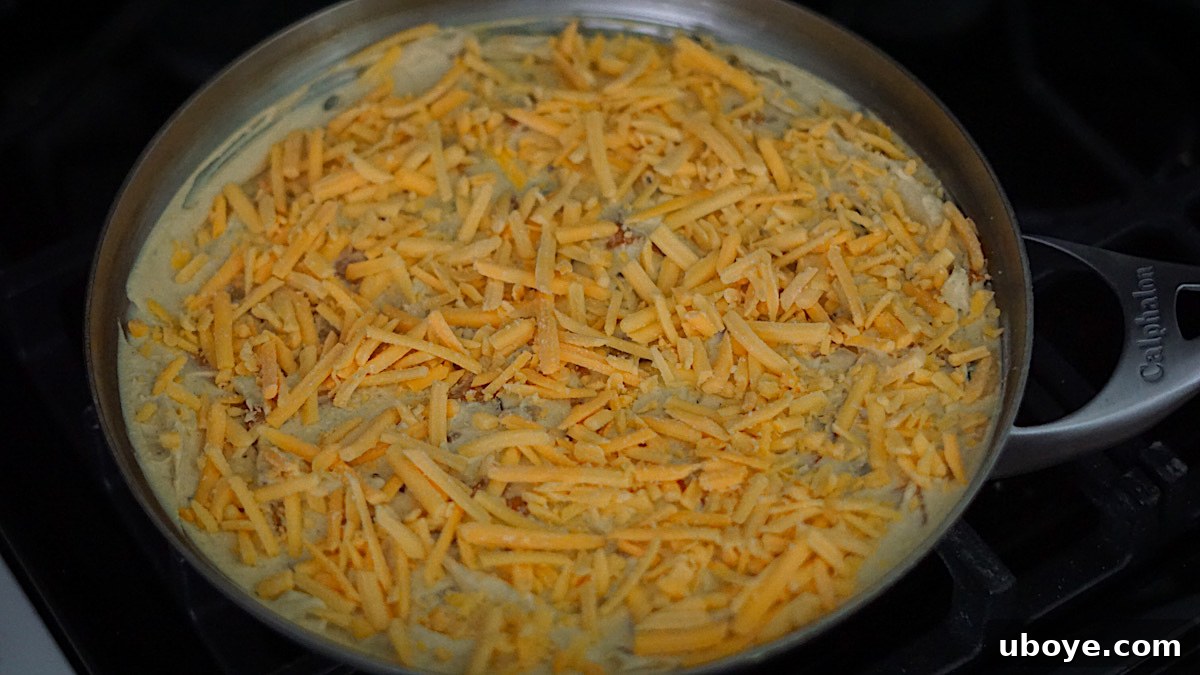 Savory Sweet Potato Skillet 9 Vegan frittata cooking on the stove top with lid on, steam visible
