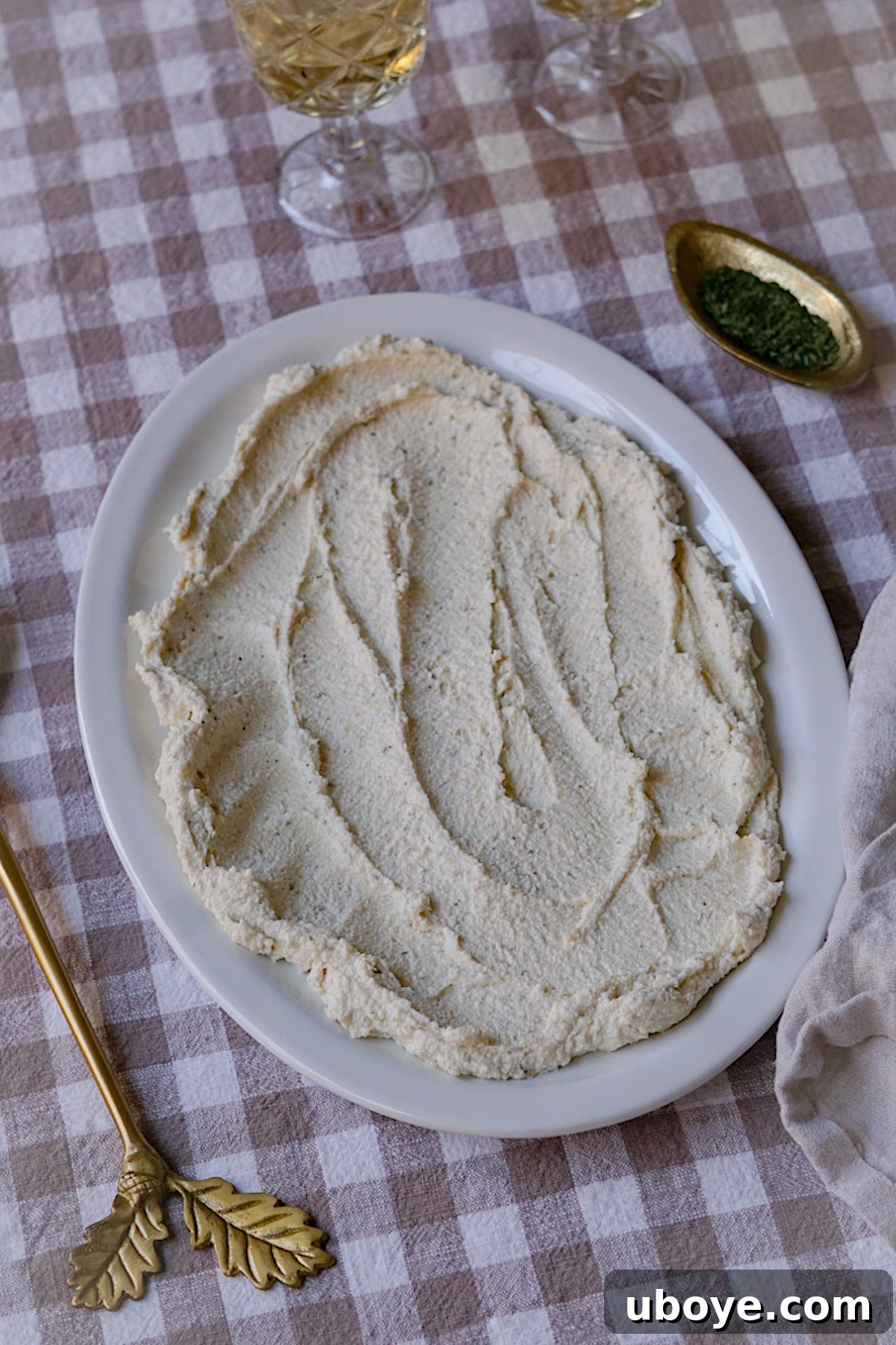 Ingredients for dairy-free whipped feta being blended in a food processor to achieve a smooth, creamy texture