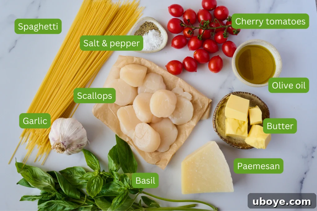 Brown Butter Scallop Pasta with Blistered Cherry Tomatoes 3 Close-up of fresh ingredients for scallop pasta including scallops, cherry tomatoes, garlic, and fresh herbs.
