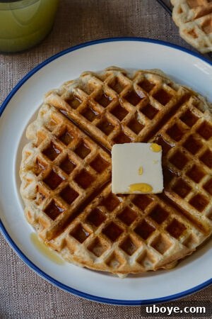 Effortless Plant-Based Waffle Perfection 13 Stack of freshly cooked vegan waffles with vegan butter and maple syrup