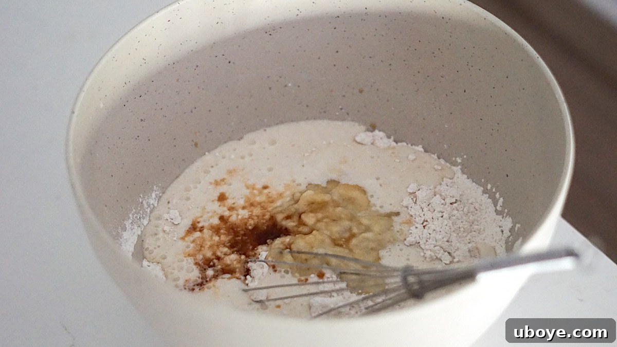Effortless Plant-Based Waffle Perfection 5 Close-up of vegan waffle batter in a mixing bowl