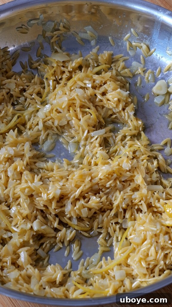 Zesty Lemon Chicken Orzo 5 A bowl of whisked eggs with minced garlic, ready for dredging.