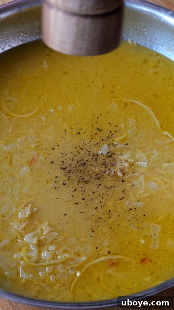 Zesty Lemon Chicken Orzo 6 Chicken cutlet being thoroughly dredged in flour before egg wash.
