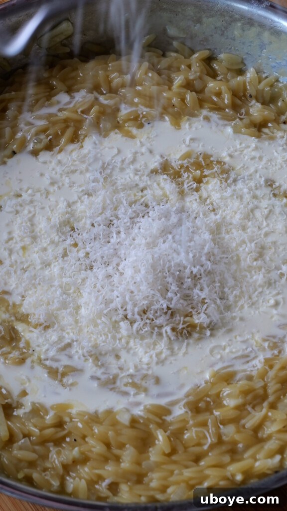 Zesty Lemon Chicken Orzo 7 Golden-brown crispy chicken frying in a pan, bubbling oil visible.