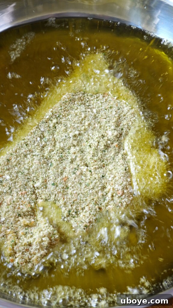 Zesty Lemon Chicken Orzo 8 Finely diced onion and sliced garlic sizzling in melted butter and olive oil in a pan, releasing their fragrance.