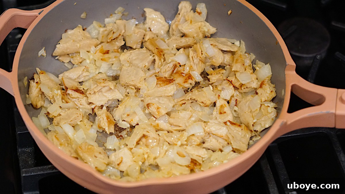 Hearty Plant-Based Broccoli Cheddar Bake 4 Sautéed vegan chicken and onions in a casserole dish