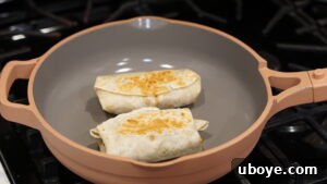 Toasting burritos in a large skillet