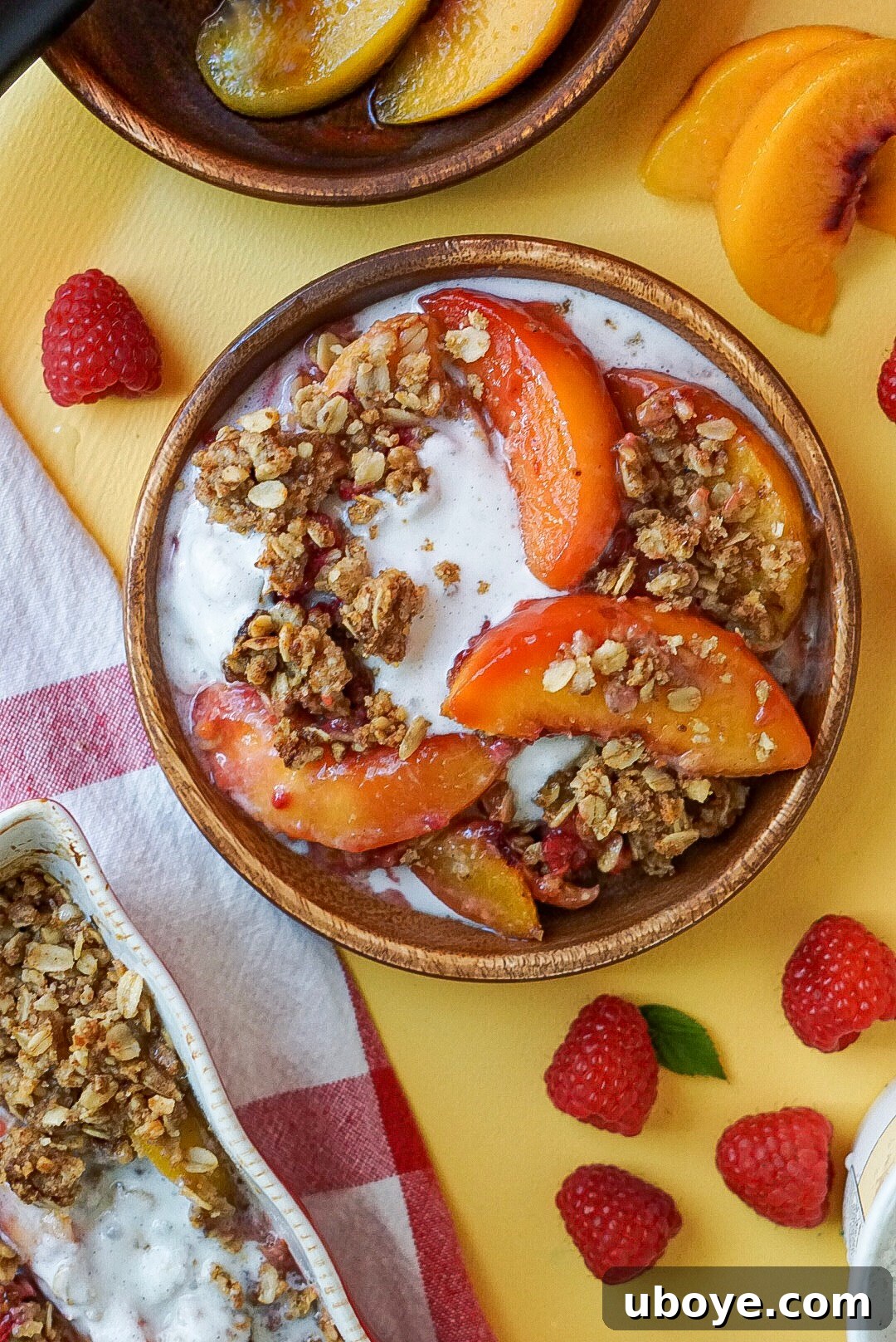 Golden Peach Raspberry Bake 2 Delicious vegan peach and raspberry crumble in a baking dish, ready to be served