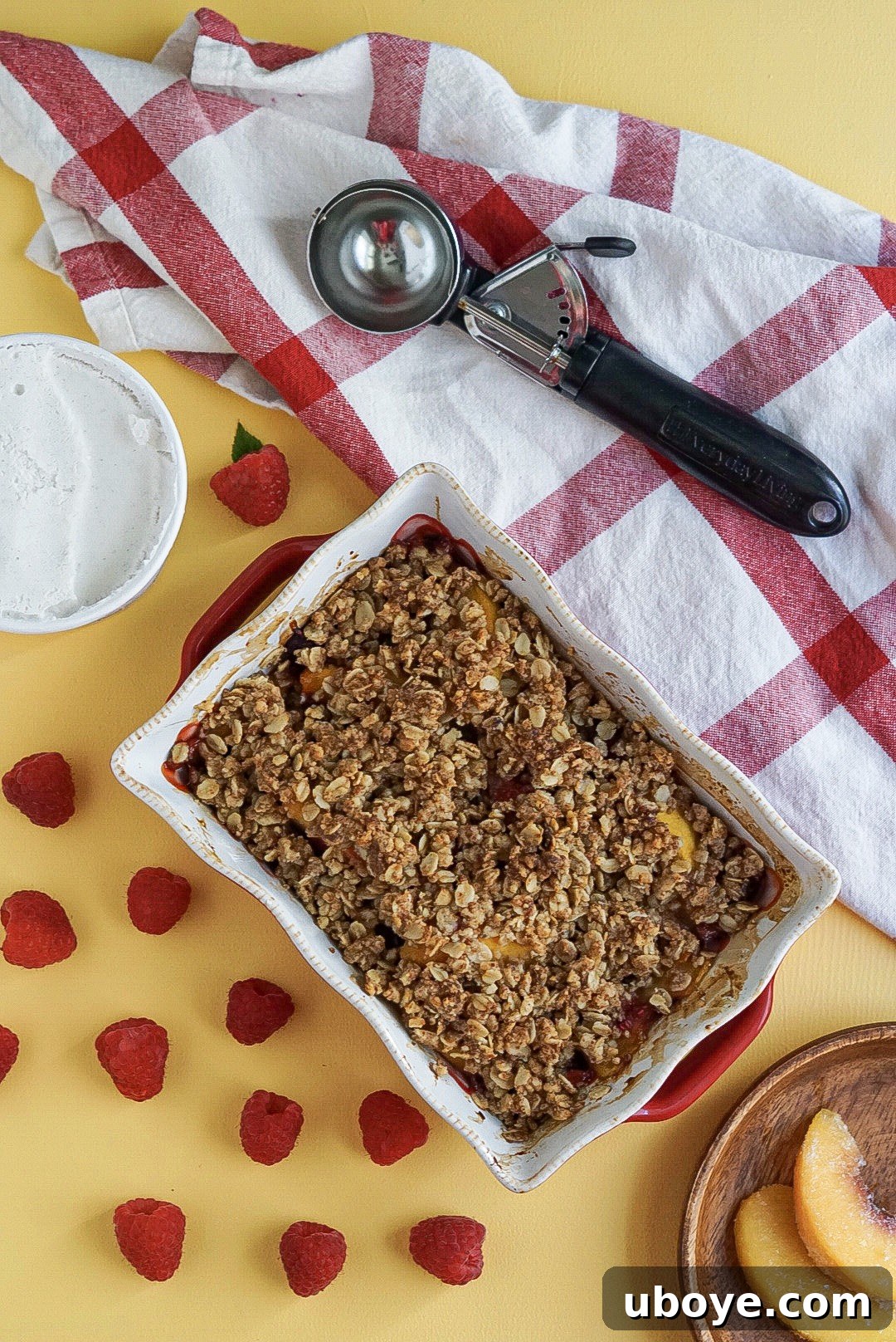 Golden Peach Raspberry Bake 3 Close-up of baked vegan peach and raspberry crumble, bubbling hot from the oven