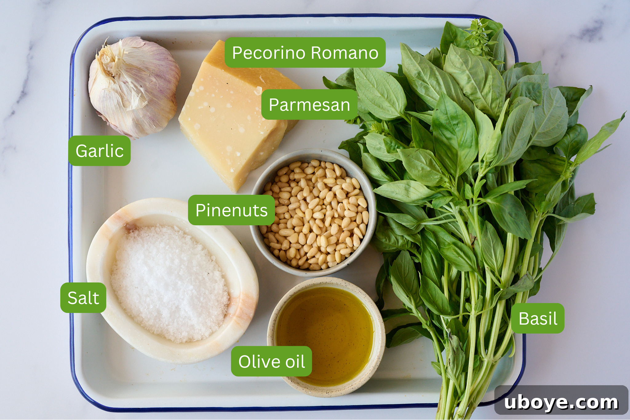 Hand-Crushed Pesto Perfection 3 A selection of fresh ingredients for pesto: basil leaves, pine nuts, garlic, and cheese blocks.