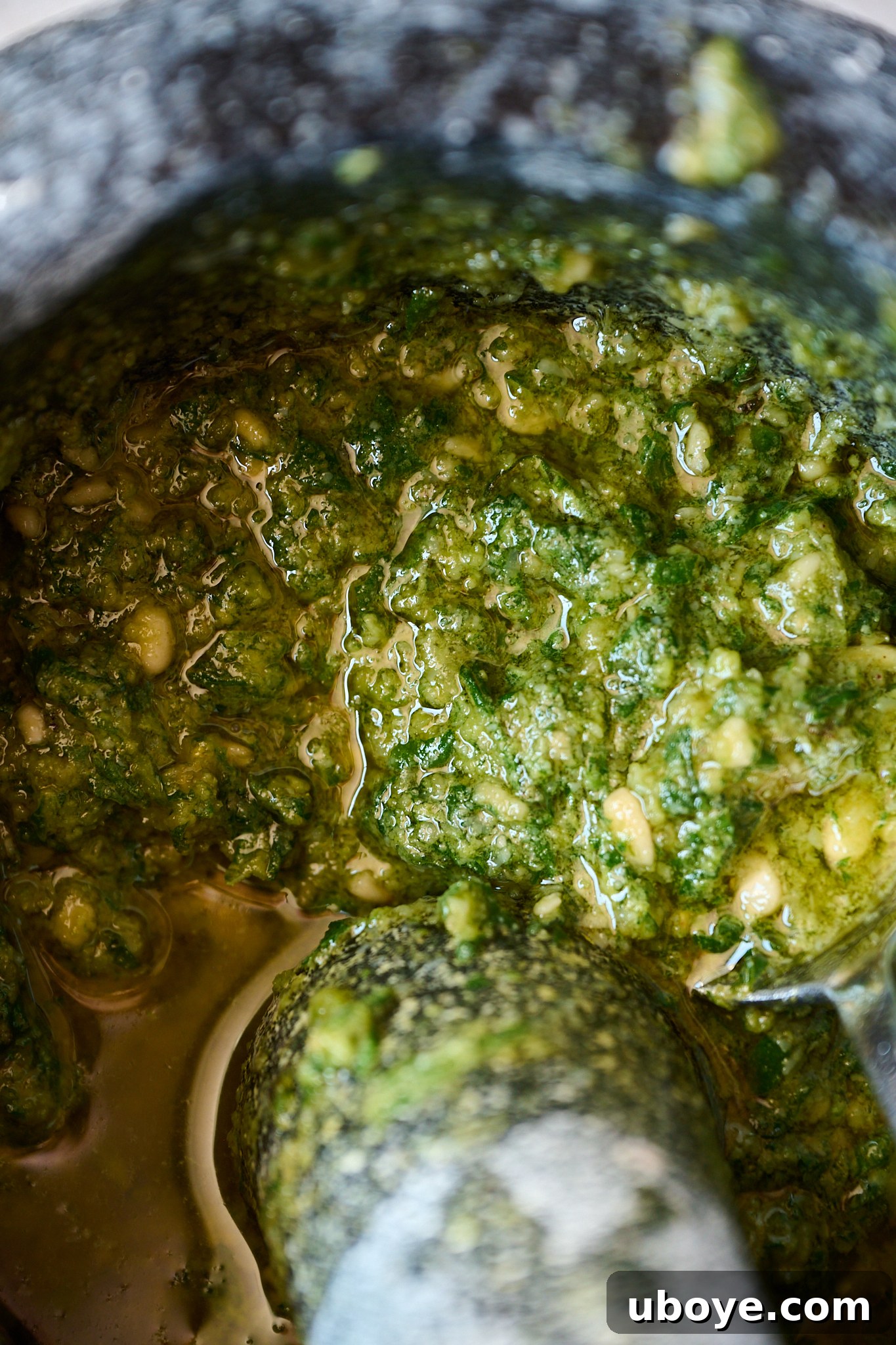 Hand-Crushed Pesto Perfection 6 Beautifully prepared pesto in a black and white mortar and pestle, ready to be served.