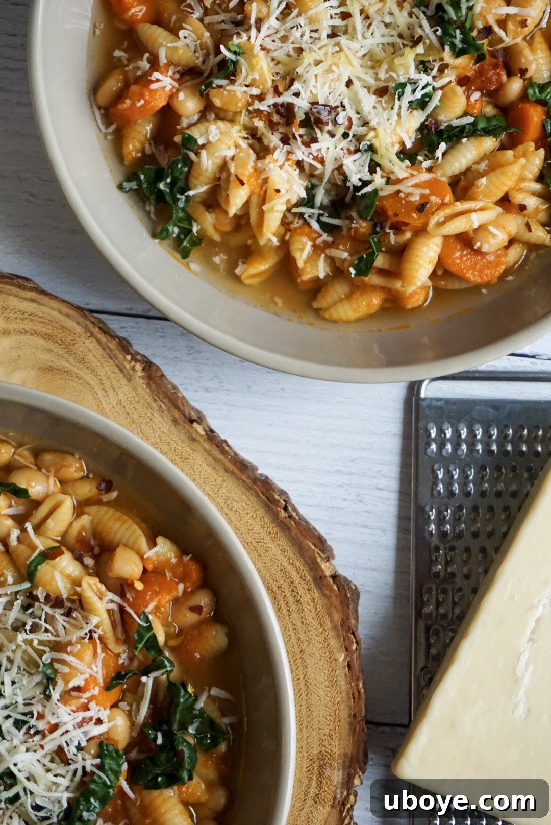 Tuscan Farmhouse Pasta and Beans 4 Two bowls of perfectly cooked Pasta e Fagioli, rich with tomatoes, white beans, and small pasta, invitingly ready to be served and enjoyed.
