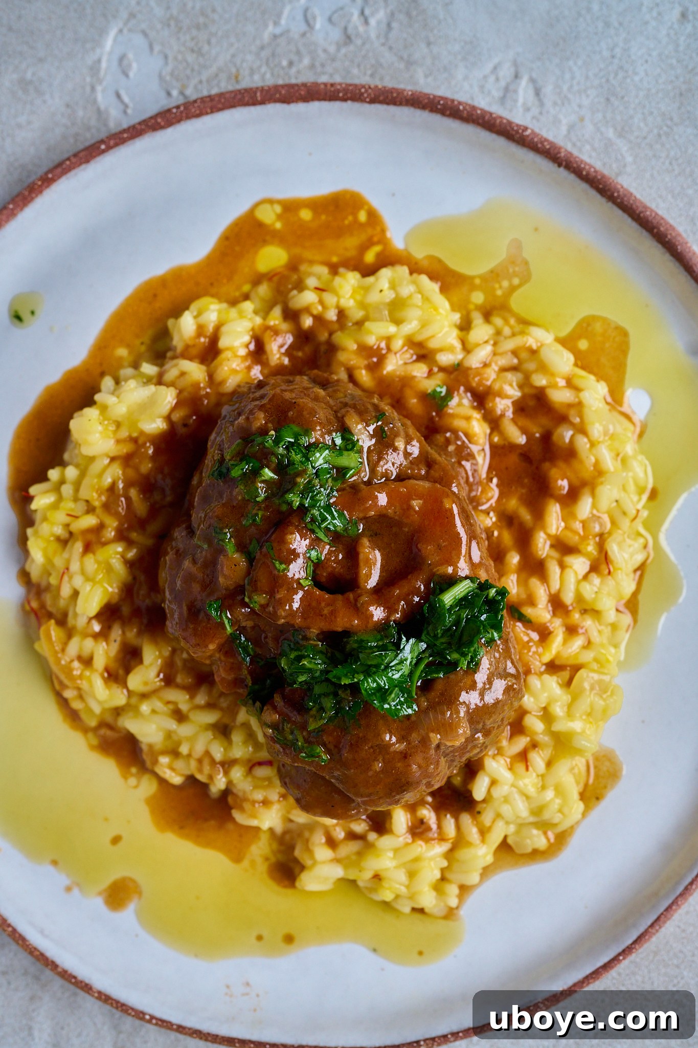 Braised Osso Buco with Zesty Gremolata and Creamy Risotto 11 Finished Osso Buco with gremolata and saffron risotto, ready to serve.