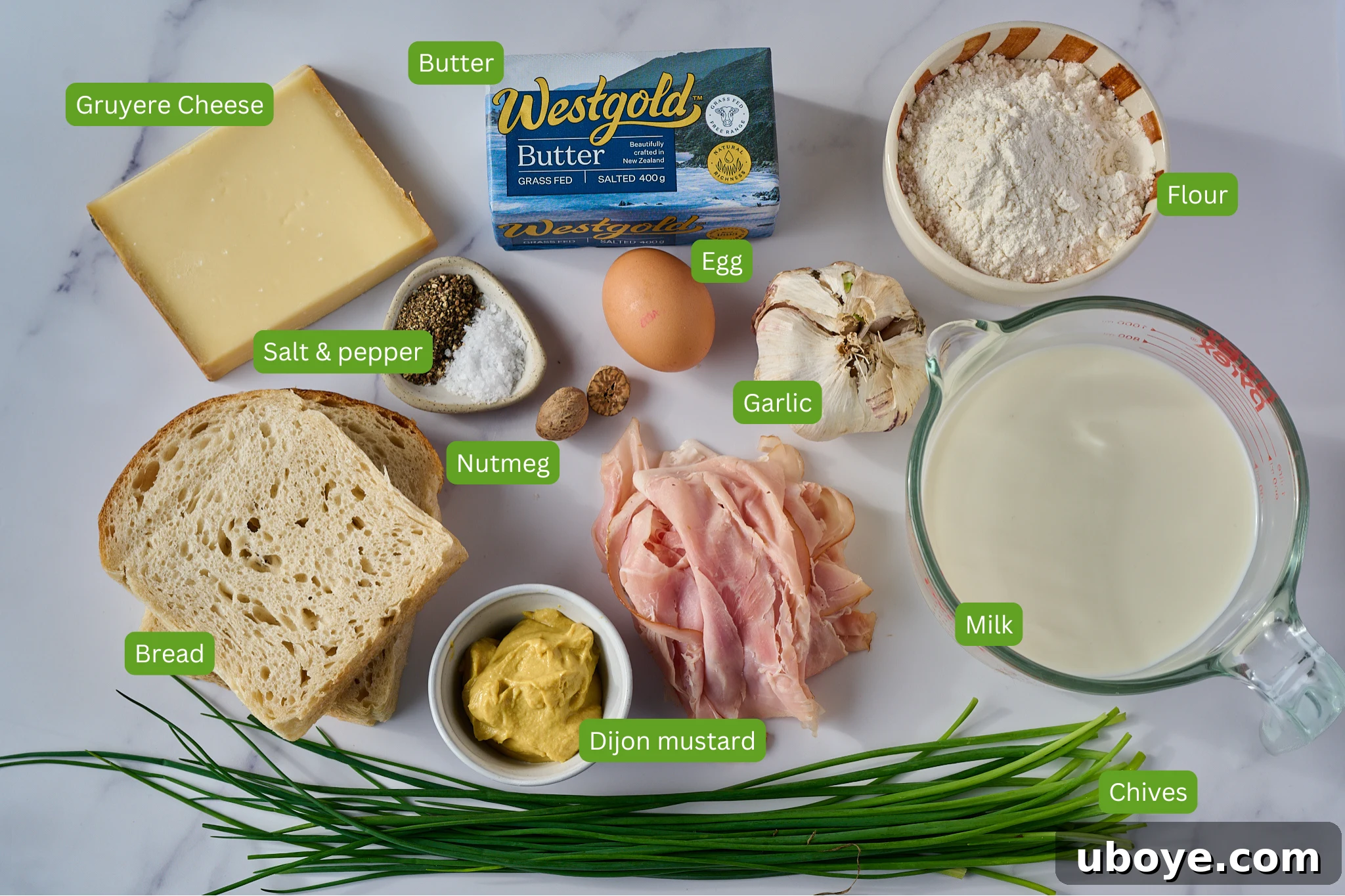 The Crowned Croque 3 Carefully selected ingredients for Croque Madame: bread, ham, Gruyere cheese, butter, milk, and eggs.