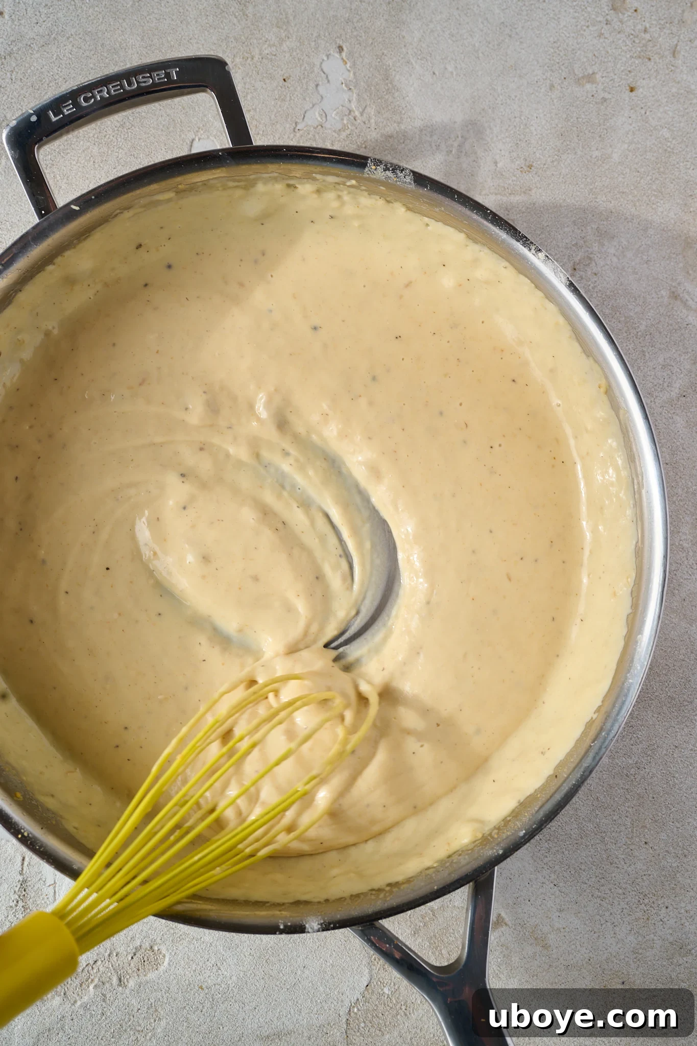 The Crowned Croque 4 Making the béchamel sauce: butter, garlic confit, and flour forming a roux.