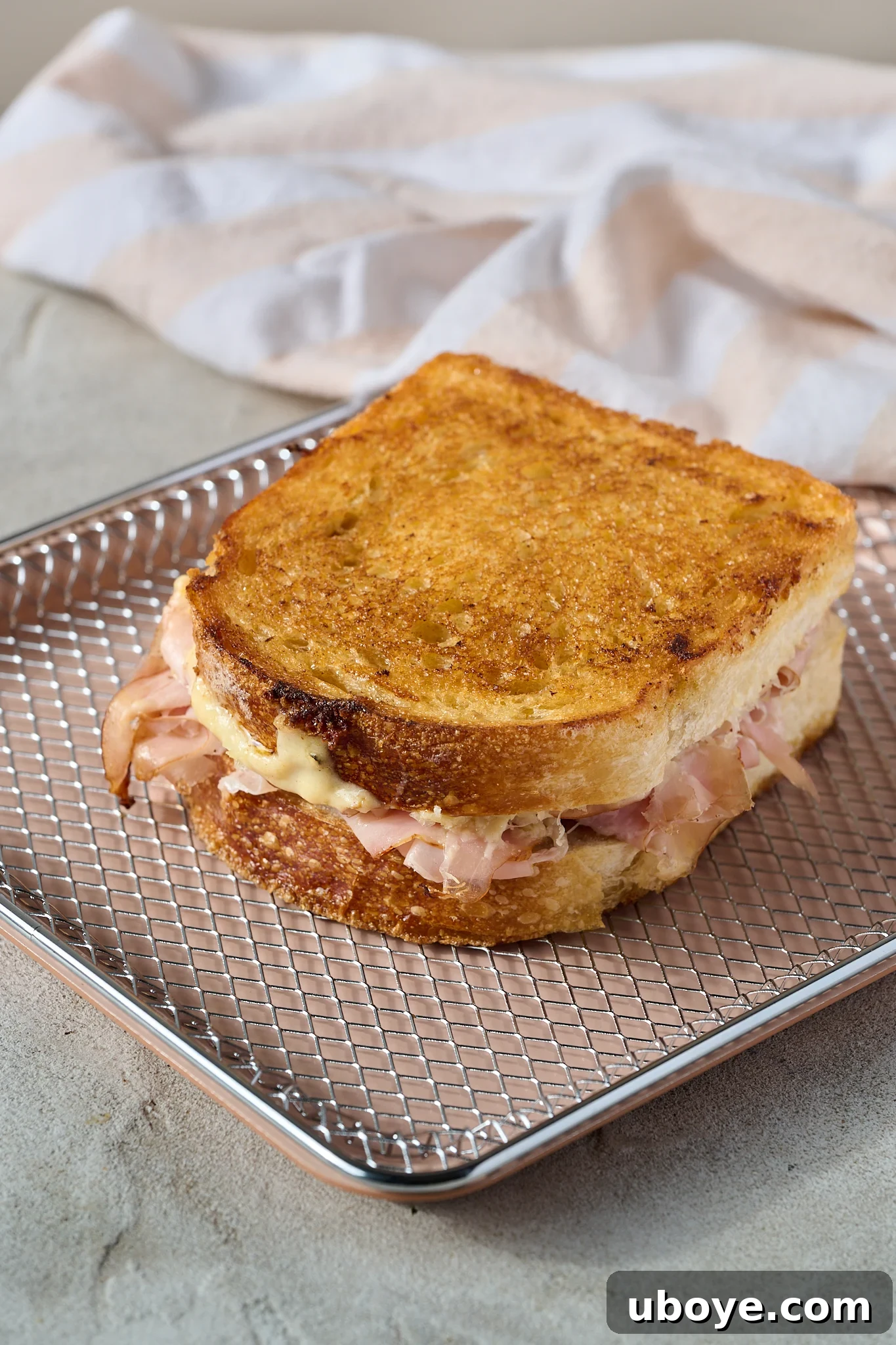 The Crowned Croque 6 Pan-frying the Croque Madame until golden and crispy.