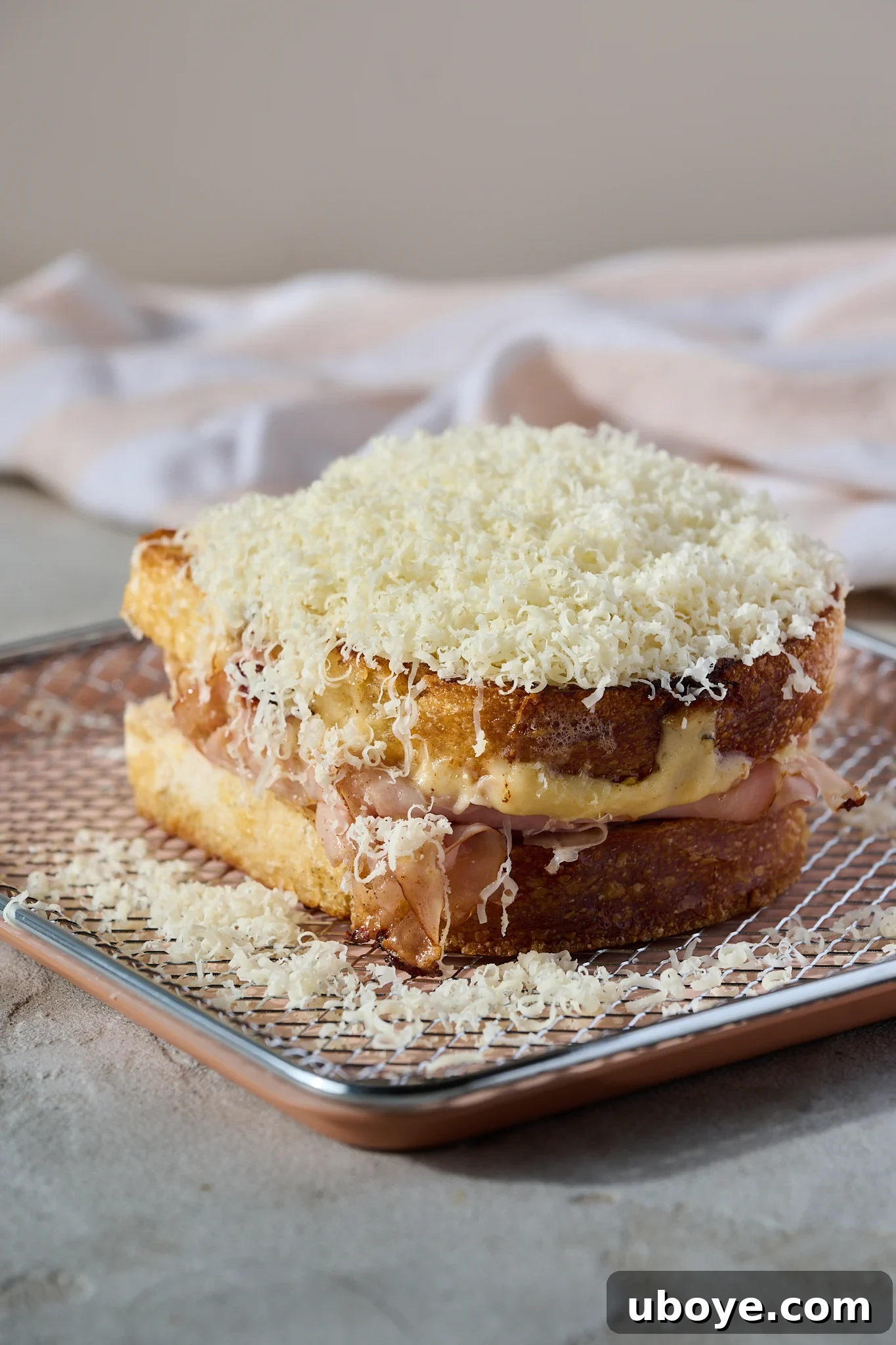 The Crowned Croque 7 The Croque Madame topped with béchamel and more Gruyere cheese, ready for grilling.
