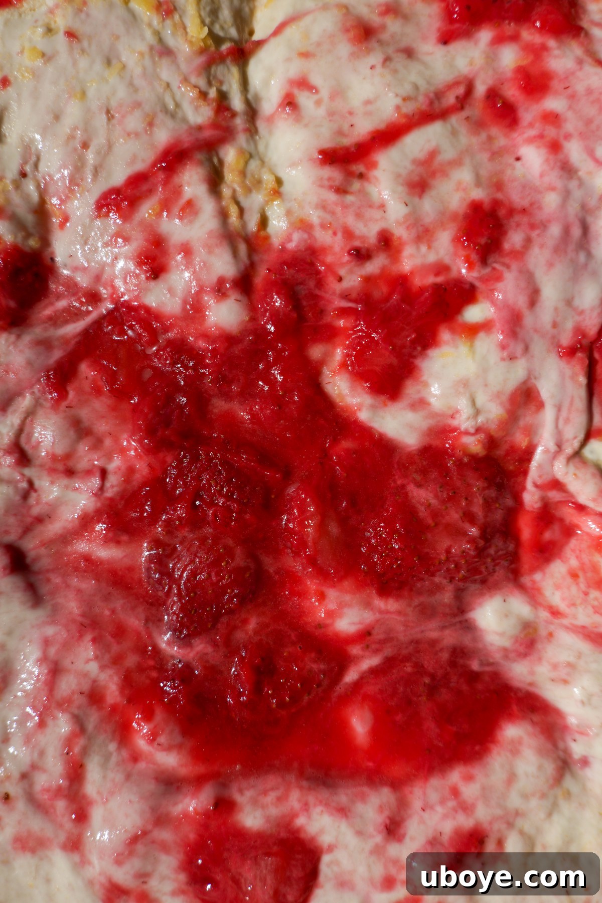 Sweet Focaccia with Strawberry Jam and Cream Cheese Glaze 6 Strawberry jam is spread over focaccia dough.