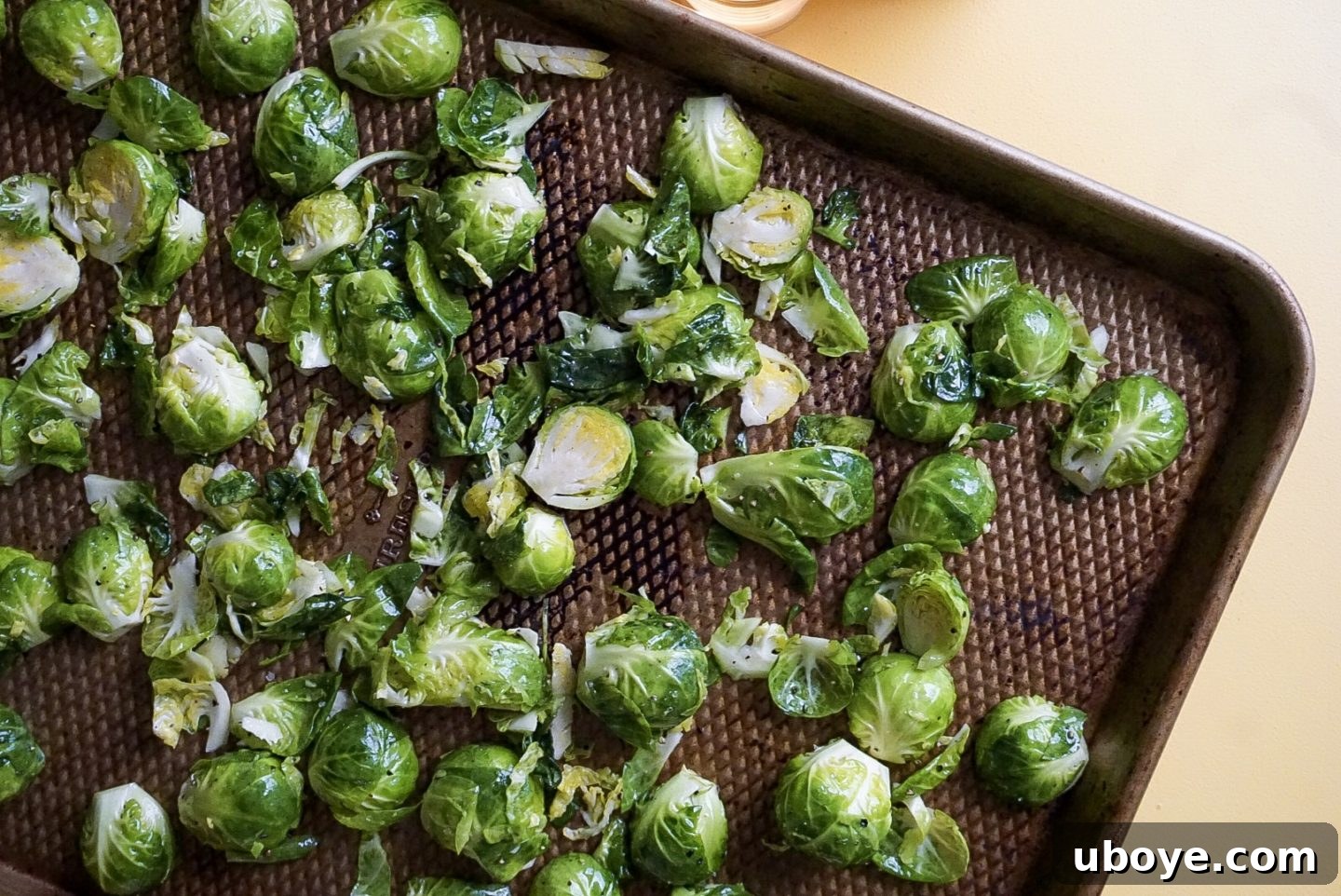 Brussels sprouts arranged cut-side down on a hot baking sheet for optimal searing.