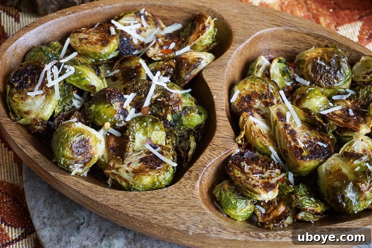 A close-up shot of the crispy, charred edges of roasted Brussels sprouts.