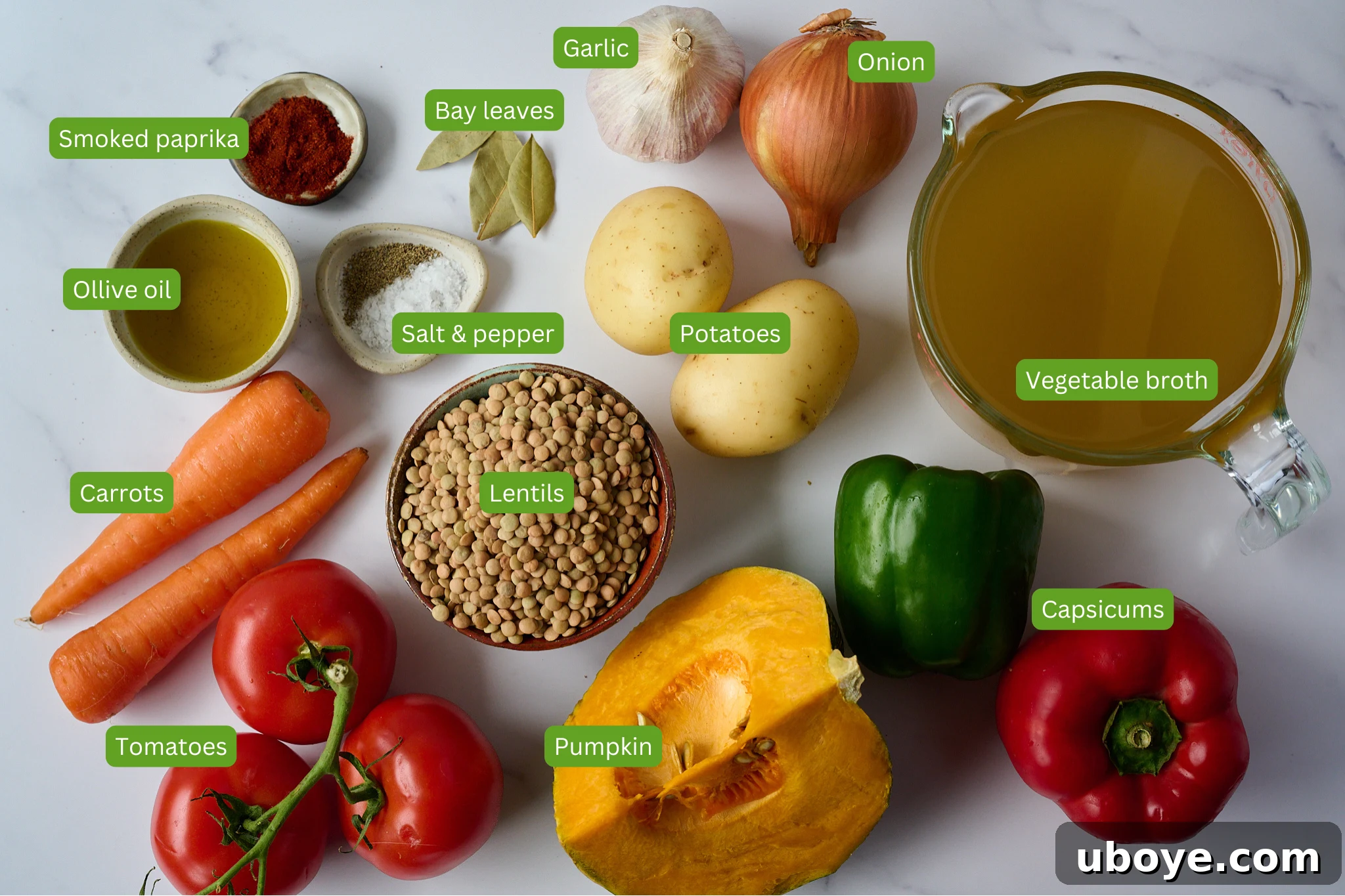Authentic Vegan Lentejas: A Spanish Comfort Stew 4 All the essential ingredients for Spanish Lentil Stew (Lentejas) laid out: potatoes, garlic, bay leaves, onion, vegetable broth, capsicums (peppers), pumpkin, tomatoes, carrots, olive oil, smoked paprika, salt, pepper, and lentils.