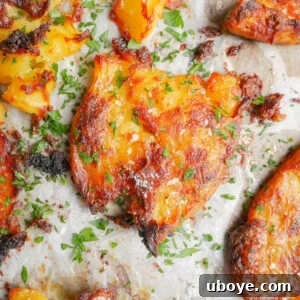 Crispy garlic butter smashed potatoes, golden and seasoned.