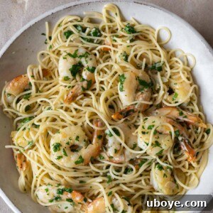Garlic butter prawn pasta, tossed with fresh herbs.