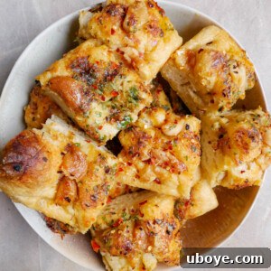 Spicy garlic confit butter focaccia, drizzled with oil.