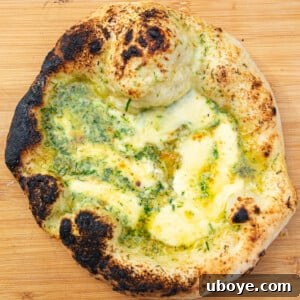 A delicious garlic bread pizza, loaded with cheese.