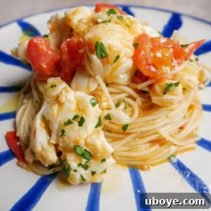 Buttered Lobster Pasta with juicy cherry tomatoes, a decadent dinner for special occasions