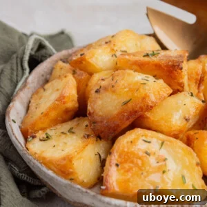Crispy Duck Fat Roasted Potatoes, golden, crunchy on the outside, and fluffy on the inside, melting in your mouth