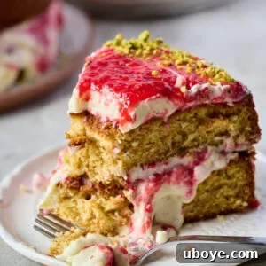 White Chocolate, Pistachio and Raspberry Olive Oil Cake with homemade jam and creamy whipped topping