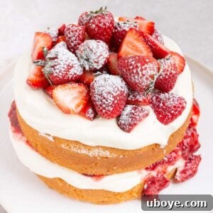 Strawberries and Cream Sponge Cake, light, fluffy, layered with whipped cream and homemade strawberry jam