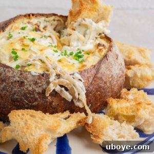 A top-down view of the baked French Onion Dip Cob Loaf, ready to be served.