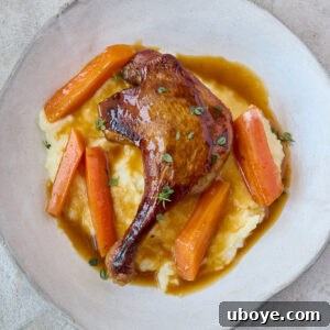 Crispy Braised Duck Legs with Spiced Orange Sauce in a recipe card format.