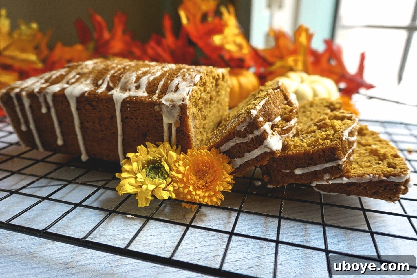 Divine Vegan Pumpkin Bread 6 A slice of vegan pumpkin bread with icing, ready to be eaten.