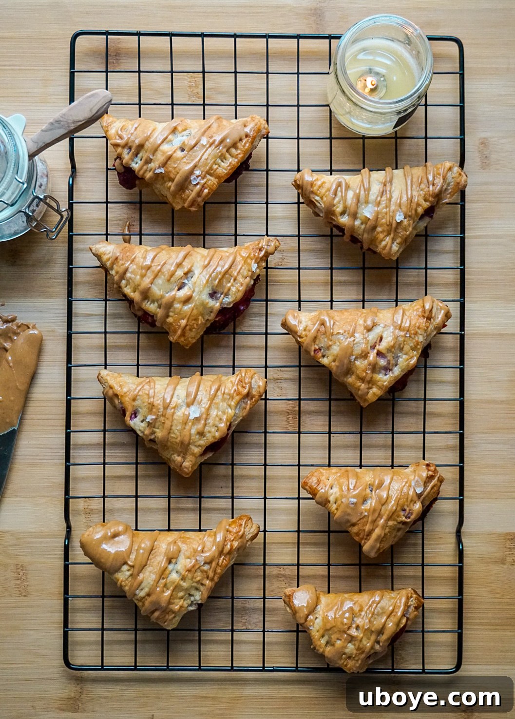 Simple Flaky PBJ Hand Pies 2 Flaky vegan peanut butter and jelly puff pastry turnovers on a plate