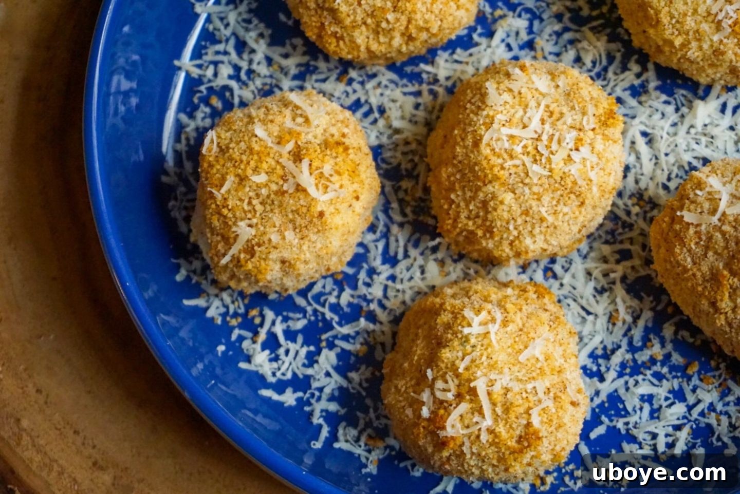 Mashed Potato Cheese Bombs 2 Crispy golden vegan cheddar stuffed mashed potato balls, perfectly fried and ready to serve.
