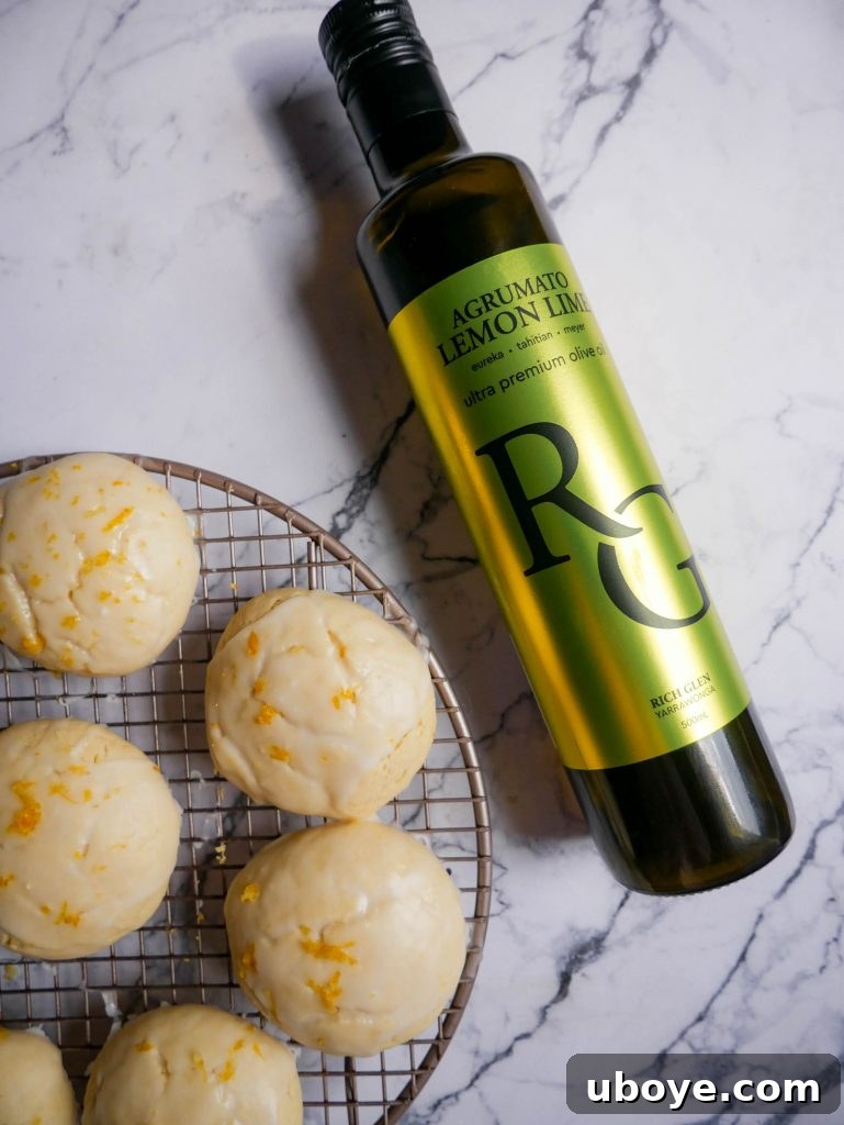 Lemon olive oil cookies alongside a bottle of olive oil