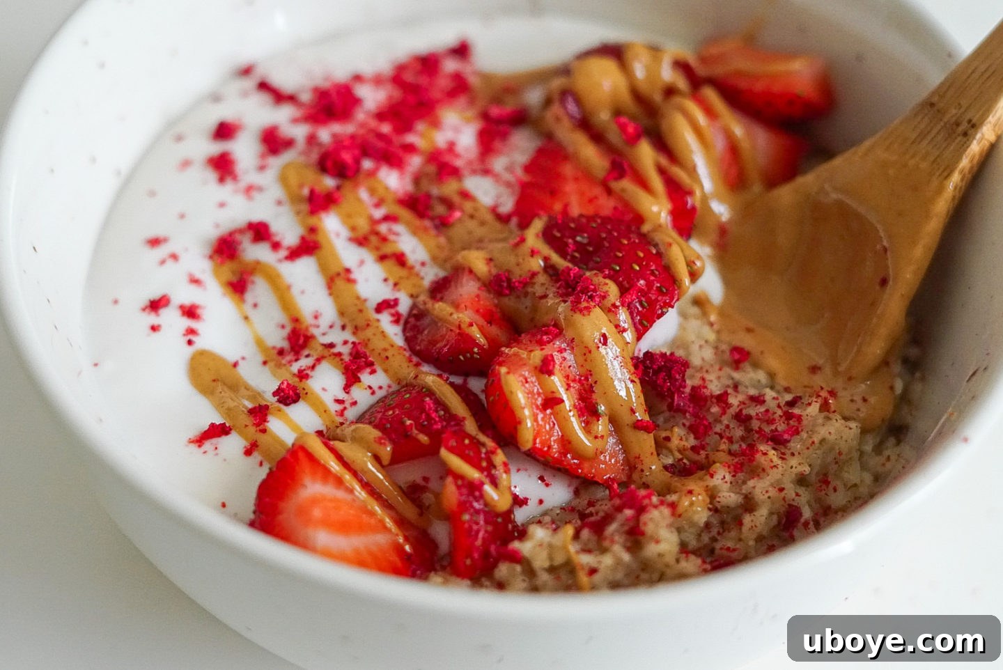 Rainbow Quick Oats 4 Overhead shot of a healthy oatmeal bowl with various toppings, emphasizing customization