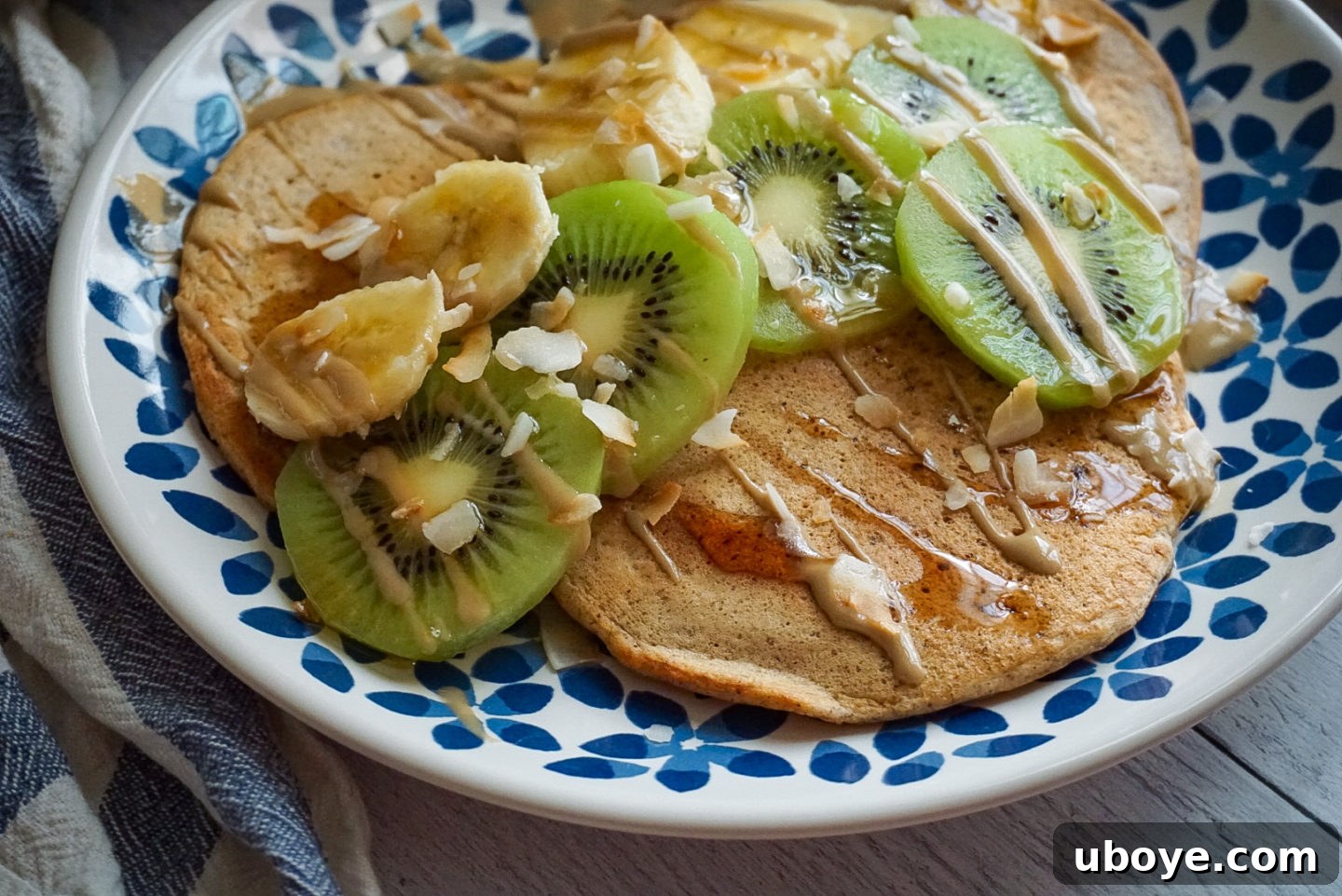 Close-up of golden brown vegan mango pancakes with a vibrant, inviting texture.