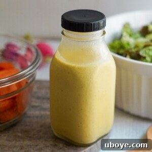 A bowl of creamy golden tahini sauce with spices