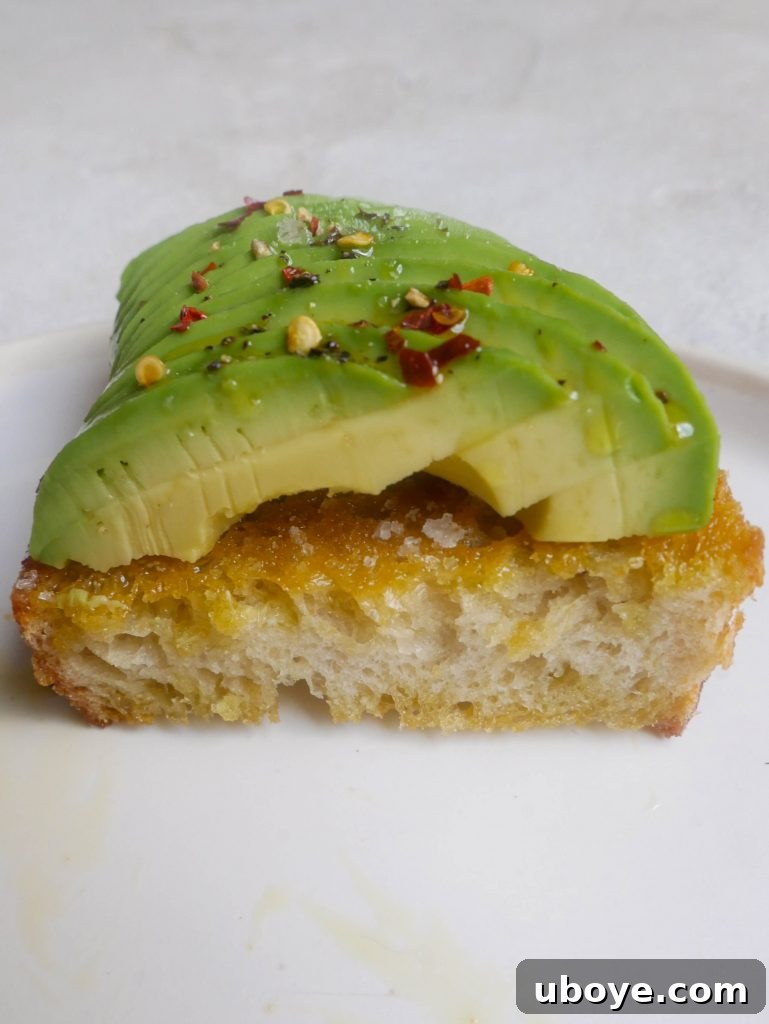 A close-up shot of avocado toast, featuring the intricate details of the avocado slices and the texture of the sourdough bread.