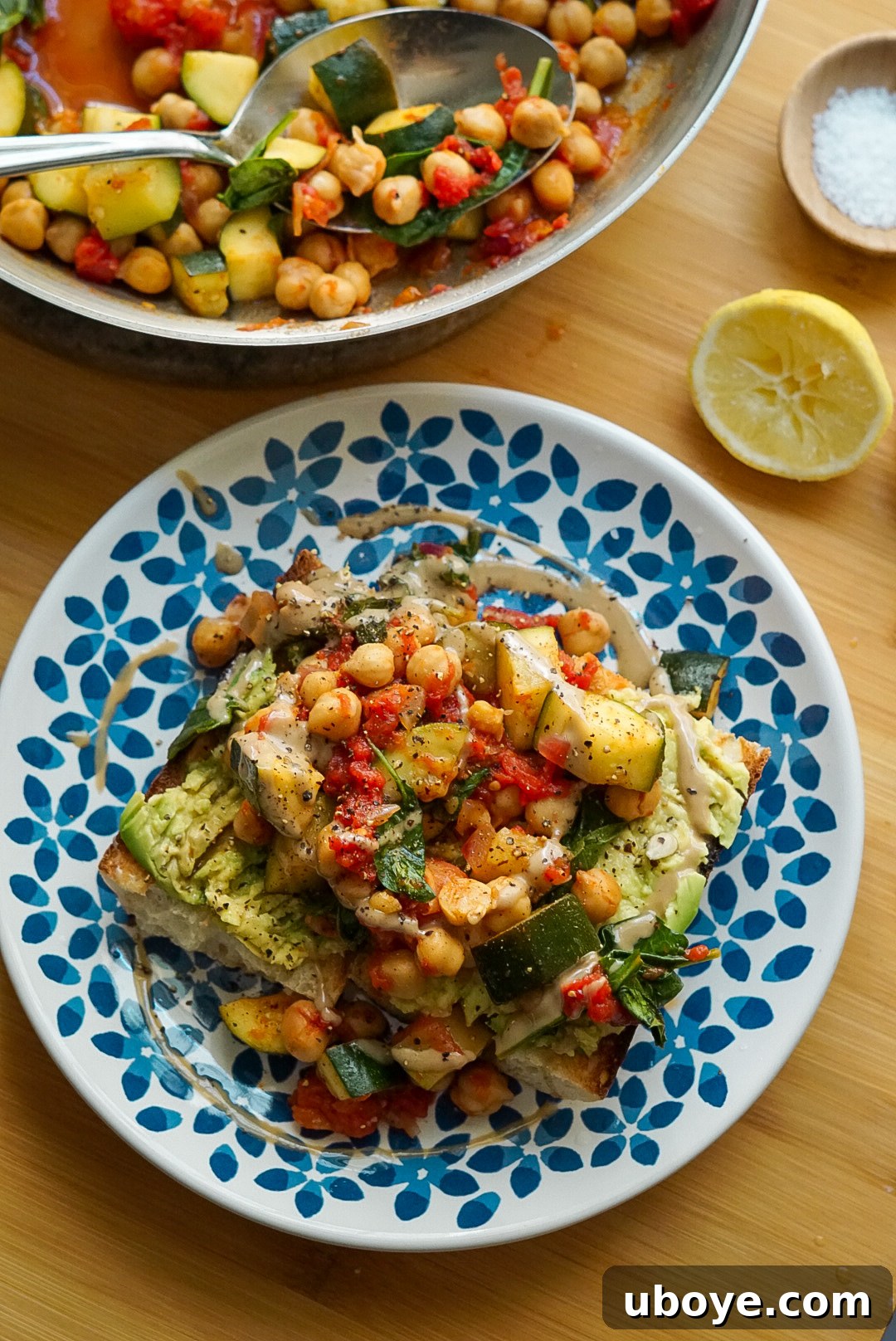 Close-up of the Italian Zucchini and Chickpea Skillet mixture, showcasing chickpeas, diced zucchini, tomatoes, and fresh basil.