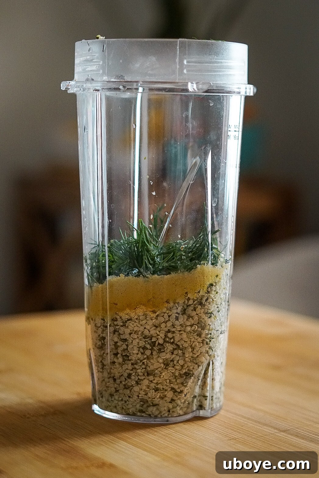 Velvety Dill Dressing 3 Close-up of creamy dill dressing in a glass jar, garnished with fresh dill sprigs, ready to be served