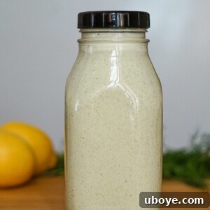 Velvety Dill Dressing 4 A small glass bowl of creamy dill dressing, garnished with a sprig of fresh dill, ready for serving
