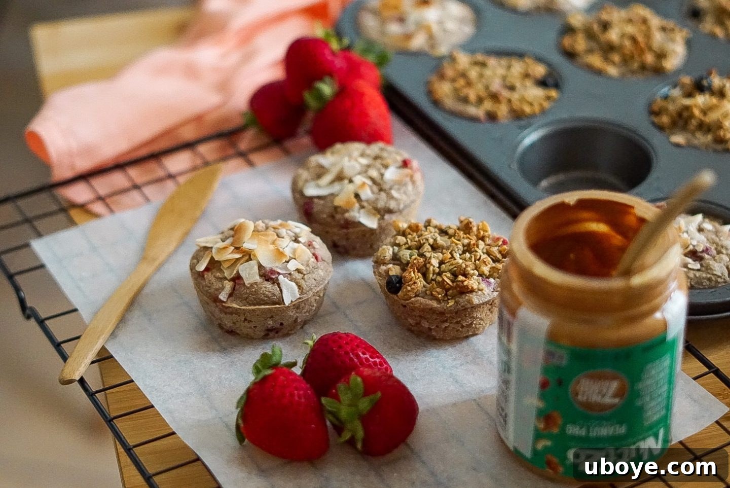 freshly baked oatmeal muffins cooling on a wire rack, steam gently rising