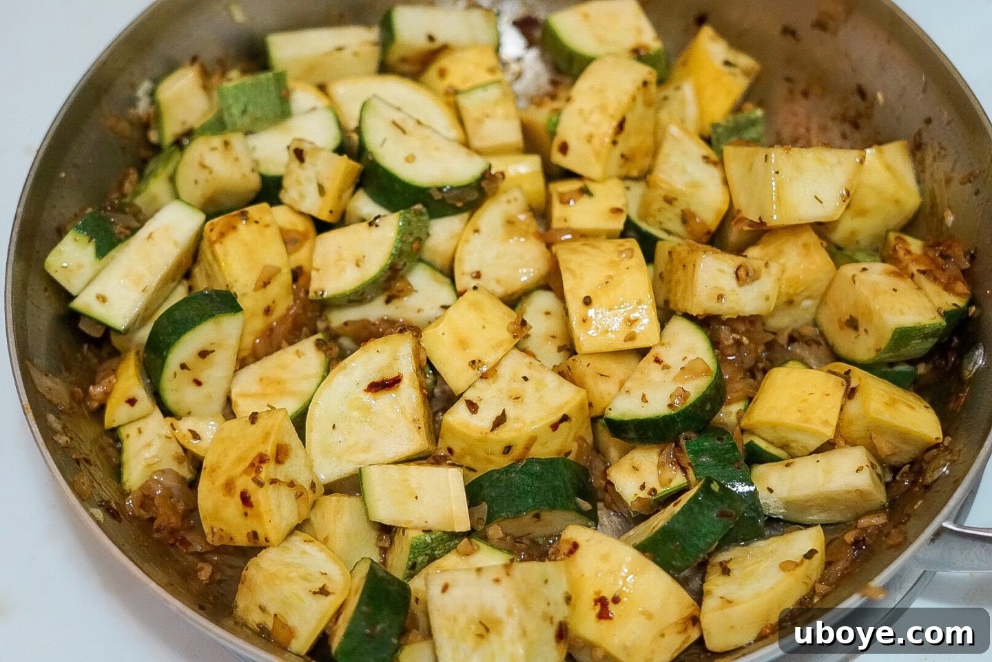 Close-up of freshly chopped yellow squash and zucchini, ready for cooking.